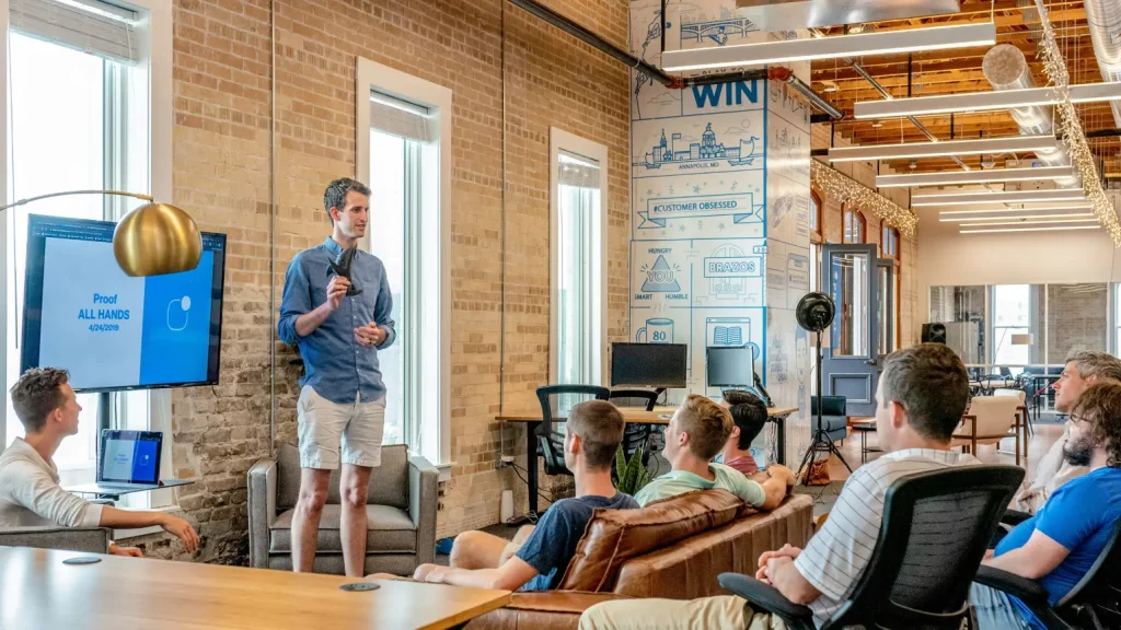 man giving talk to a group of people