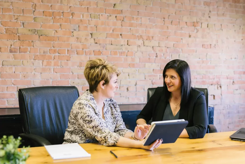 women doing business together at a table